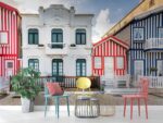 Colorful wooden striped facade in historic neighborhood, Portugal.